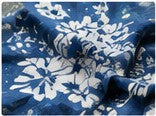 Close-up of blue floral print showing fine detail and sharp lines