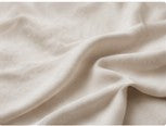 Pattern repeat flowing seamlessly across linen fabric texture