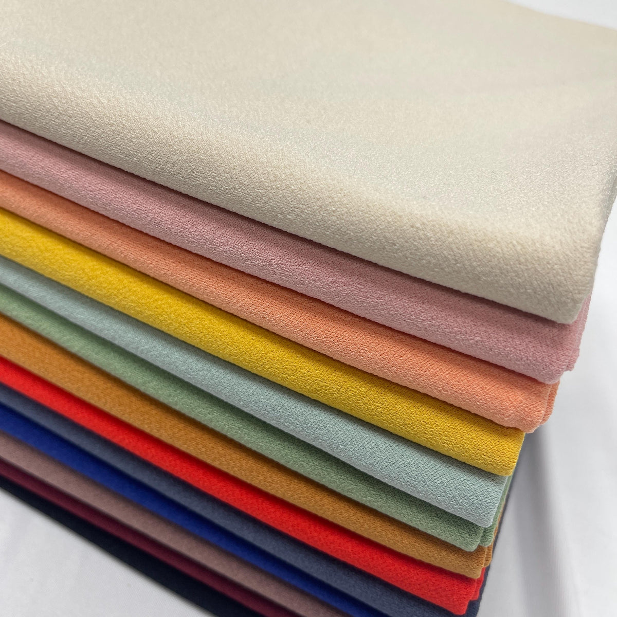 K-crepe/Knit Solid Color Textured Poly. 60" width. Fabric By The Yard.
